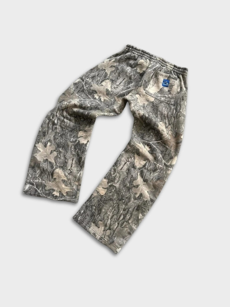 Calça de moletom Deus x Decarba